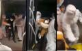 近日一群身穿防护衣的军人粗暴的将民众推上隔离专车，令当地市民愤怒。（图片来源：视频截图）