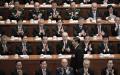习近平与出席两会的官员。（NICOLAS ASFOURI/AFP/Getty Images）