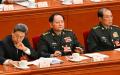 2025年3月5日，中共军委副主席何卫东（右）和军委副主席张又侠（中）出席在北京人民大会堂举行的全国人民代表大会开幕会议。（图片来源：ADEK BERRY/AFP via Getty Images）