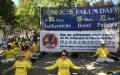纪念7.20反迫害27周年集会活动当日，巴黎部分法轮功学员在集会现场展示法轮功五套功法。（图片来源：法国看中国记者站）