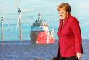 默克尔主持海上风力发电场落成典礼后，离开讲台。（Getty Images）