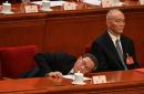 2024年3月11日，中共国务院总理李强（左）与中央办公厅主任蔡奇（右）在出席第十四届全国人大闭幕会议。（图片来源：JADE GAO/AFP via Getty Images）