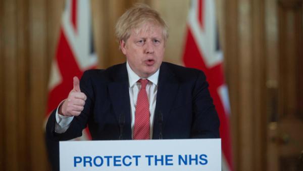 英国首相约翰逊20日在伦敦举行新闻发布会。(Getty Images)