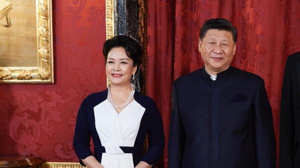 习近平和彭丽媛(图片来源: Photo by Carlos Alvarez/Getty Images)