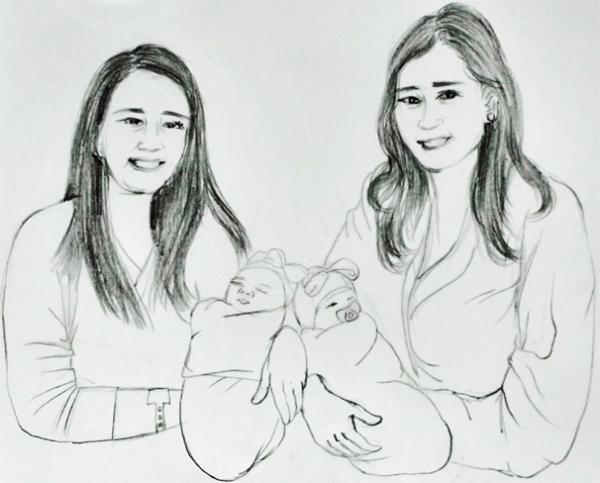 沃登•萧(左)和安珀•特拉蒙塔纳与她们的女儿(图:清玉/看中国)