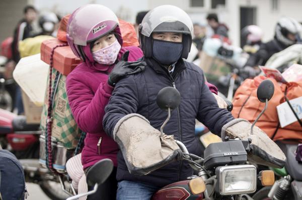 东北外出务工人员返乡。(Wang He/Getty Images)