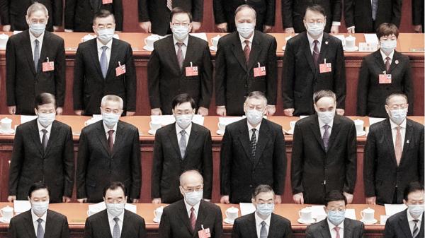 大陆官员在会议现场(Kevin Frayer/Getty Images)