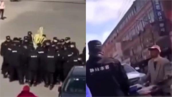 20多名城管街头身围住一名老人,将他车上甘蔗全部抢走,老人急得大哭。(图片来源:视频截图)