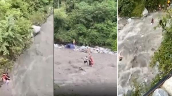 四川省彭州市一河道突发山洪,不少正在玩水的游客来不及逃离,有人在水中挣扎,有人被大水冲走,目前伤亡等情况在调查中。(图片来源:视频截图)