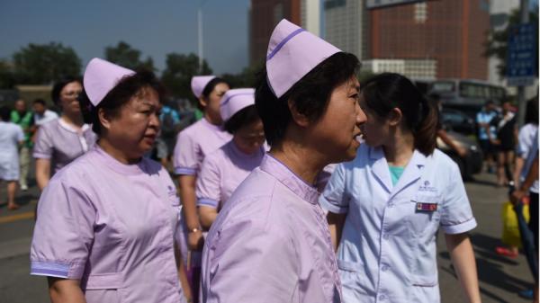 近日深圳、西安等地又出现群体感染“诺如病毒”事件。示意图。(图片来源:GREG BAKER/AFP via Getty Images)