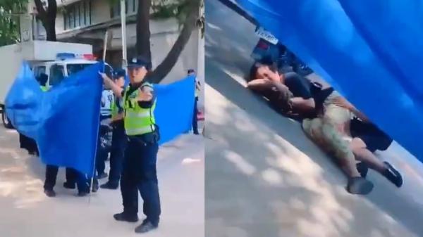 广州警察暴力执法打倒老妇致不省人事,母女凄惨哭喊。(图片来源:视频截图)