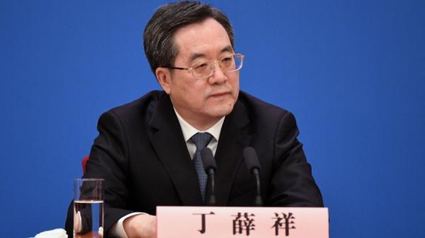 2023年3月13日,中国国务院副总理丁薛祥出席国务院总理李强主持的记者会。(图片来源:GREG BAKER/AFP via Getty Images)