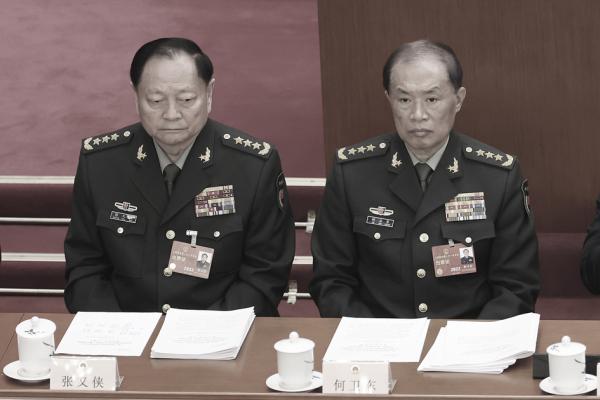 张又侠与何卫东（Lintao Zhang/Getty Images）