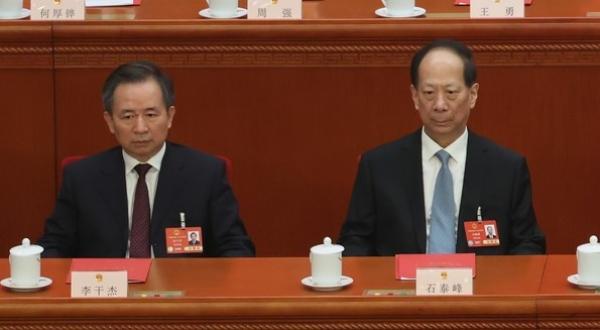 025年3月11日，在中共全国人民代表大会闭幕式现场。图为时任中组部长李干杰（左）和时任统战部部长石泰峰（右）。