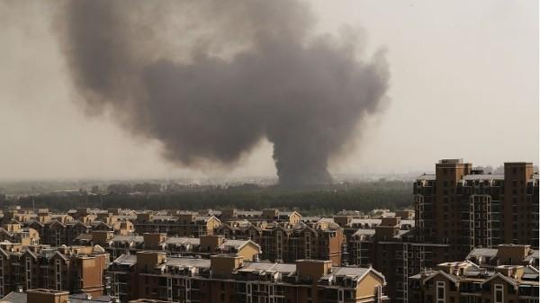 2017年5月1日,北京蟹岛度假村附近浓烟滚滚。示意图 (图片来源:Lintao Zhang/Getty Images)
